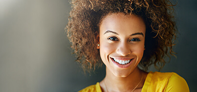 Young woman smiling to show off her bright, white teeth