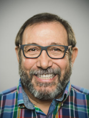 dentures in baton rouge - older man wearing glasses and smiling