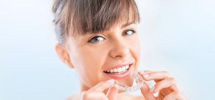 Woman with clear aligners