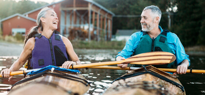 happy couple kayaking together