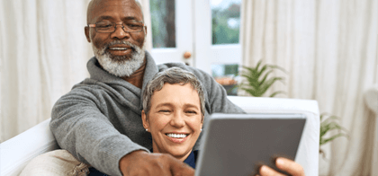 couple with dentures smiling