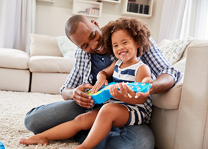 dad and daughter playing guitar