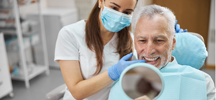 senior man at the dentist